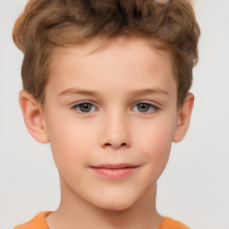 Joyful white child male with short  brown hair and brown eyes