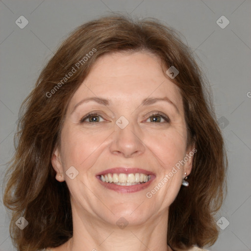 Joyful white adult female with medium  brown hair and brown eyes