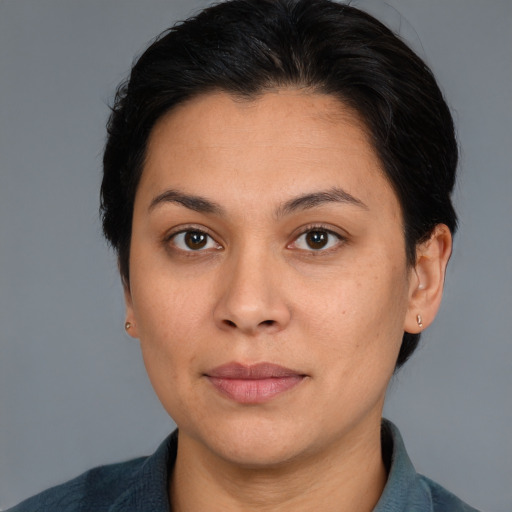 Joyful white adult female with medium  brown hair and brown eyes