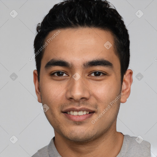 Joyful latino young-adult male with short  black hair and brown eyes