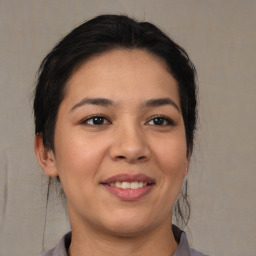 Joyful asian young-adult female with medium  brown hair and brown eyes