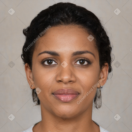 Joyful black young-adult female with short  black hair and brown eyes