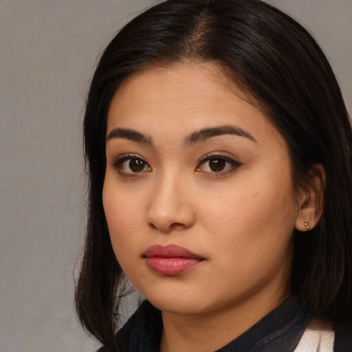 Neutral asian young-adult female with long  brown hair and brown eyes