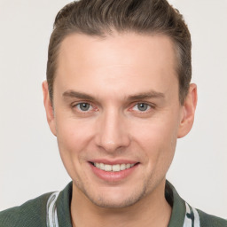 Joyful white young-adult male with short  brown hair and grey eyes