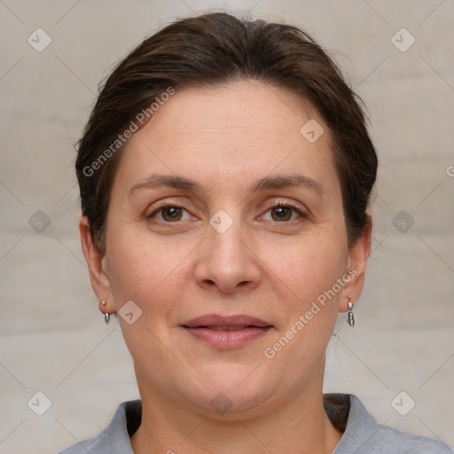 Joyful white adult female with short  brown hair and grey eyes