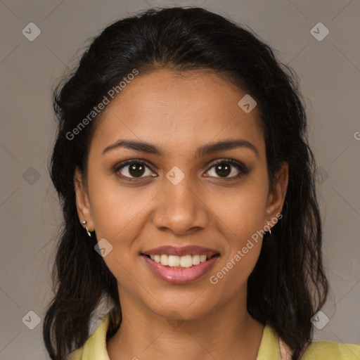 Joyful black young-adult female with medium  brown hair and brown eyes