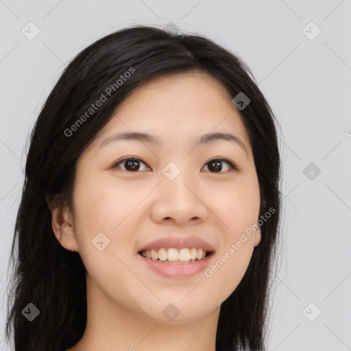 Joyful asian young-adult female with long  black hair and brown eyes