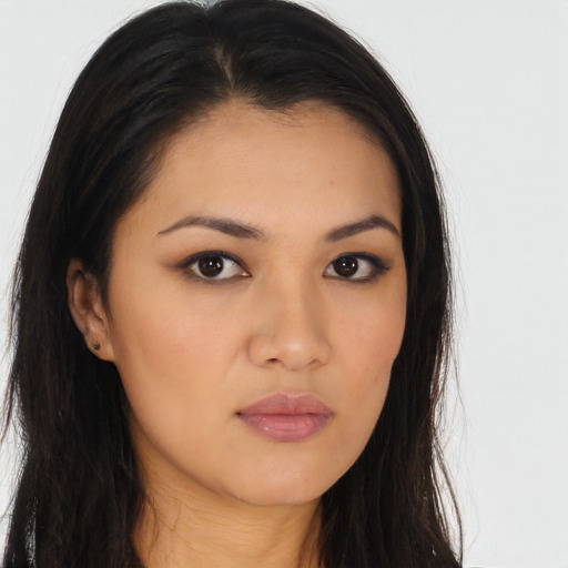 Neutral latino young-adult female with long  brown hair and brown eyes