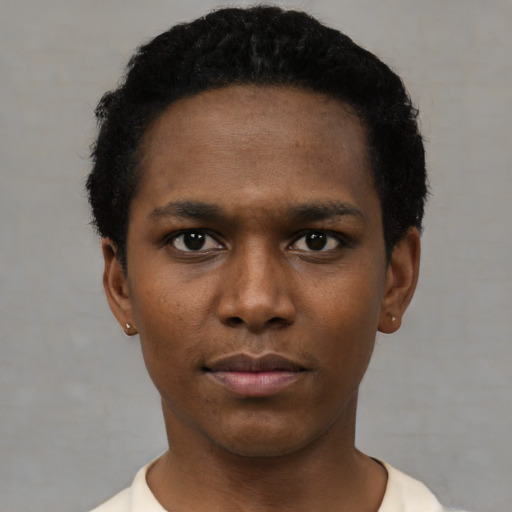 Neutral black young-adult male with short  black hair and brown eyes