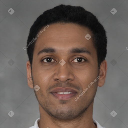 Joyful latino young-adult male with short  black hair and brown eyes