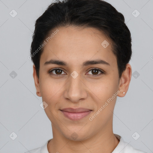 Joyful latino young-adult female with short  black hair and brown eyes