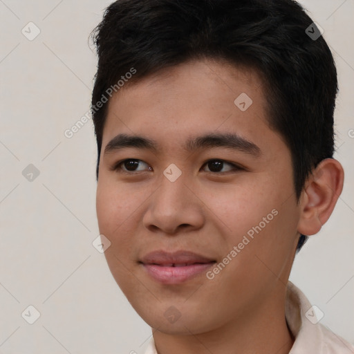 Joyful asian young-adult male with short  brown hair and brown eyes