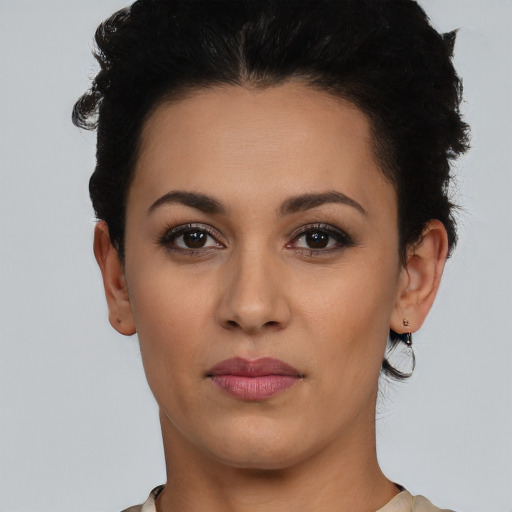 Neutral latino young-adult female with short  black hair and brown eyes