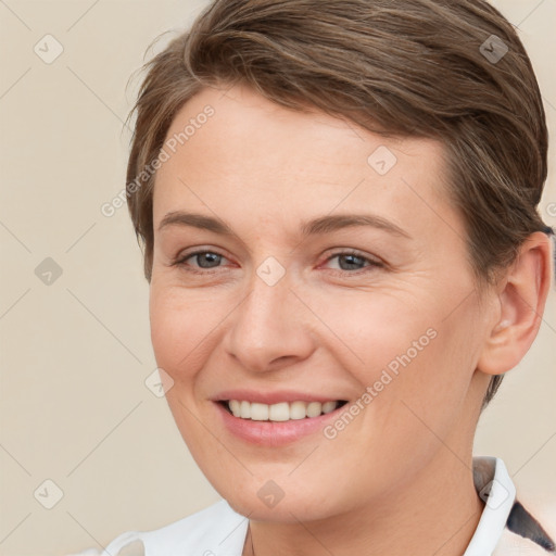 Joyful white young-adult female with short  brown hair and grey eyes