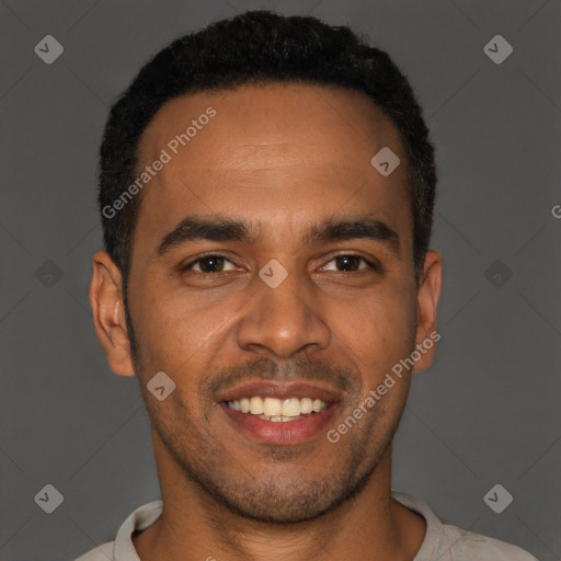 Joyful black young-adult male with short  black hair and brown eyes