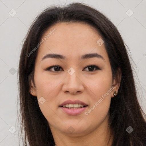 Joyful asian young-adult female with long  brown hair and brown eyes