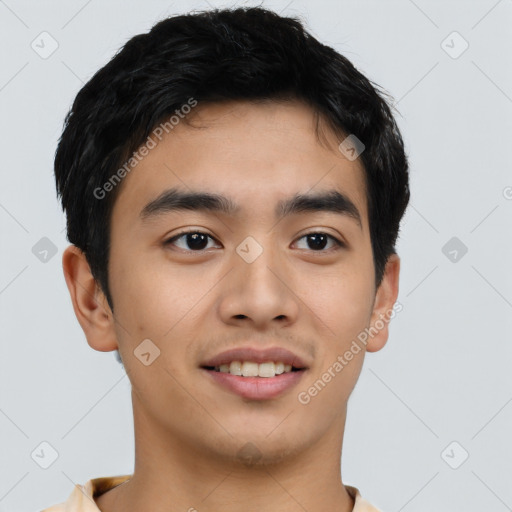 Joyful asian young-adult male with short  black hair and brown eyes