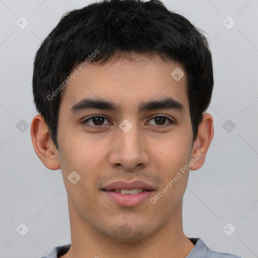 Joyful white young-adult male with short  black hair and brown eyes