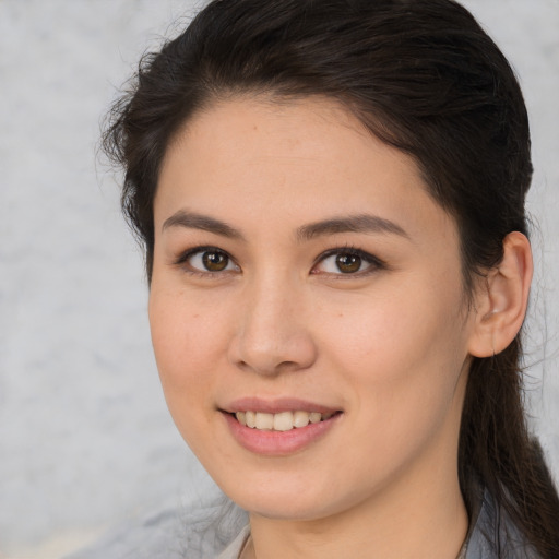 Joyful white young-adult female with medium  brown hair and brown eyes