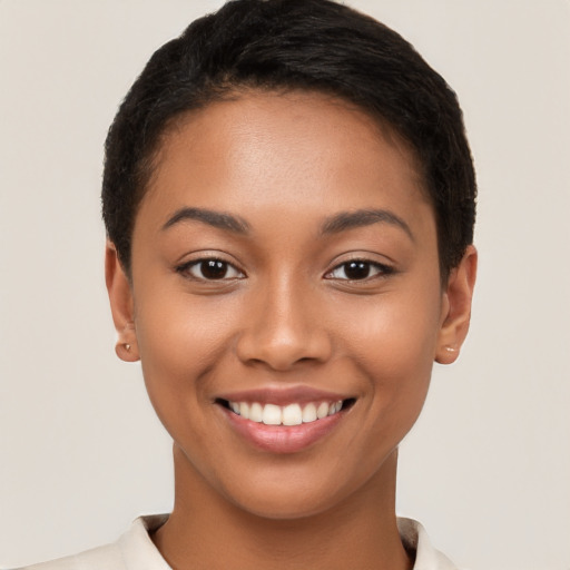 Joyful latino young-adult female with short  brown hair and brown eyes