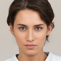 Neutral white young-adult female with medium  brown hair and brown eyes