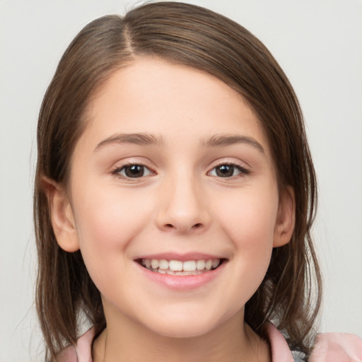 Joyful white child female with medium  brown hair and brown eyes