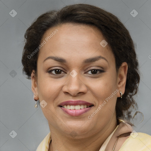 Joyful latino adult female with short  brown hair and brown eyes