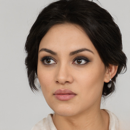 Neutral white young-adult female with medium  black hair and brown eyes