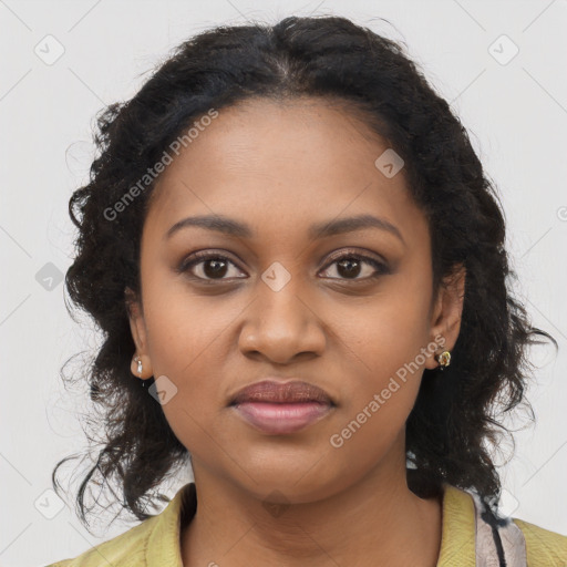 Joyful black young-adult female with long  brown hair and brown eyes