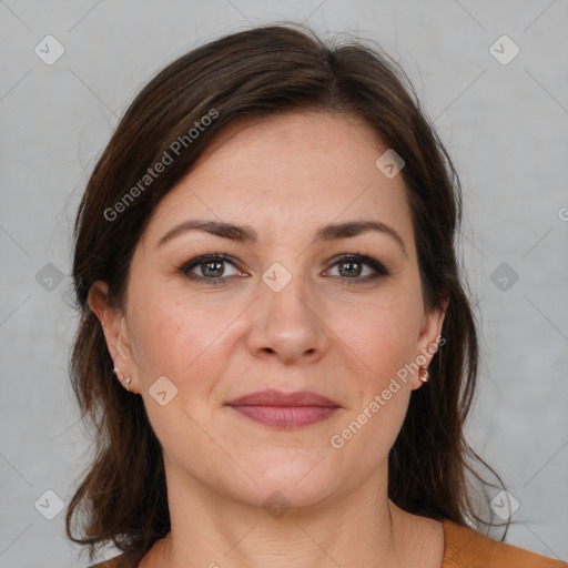 Joyful white adult female with medium  brown hair and brown eyes