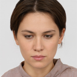 Neutral white young-adult female with short  brown hair and brown eyes