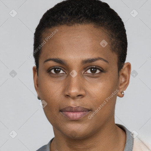 Joyful black young-adult female with short  black hair and brown eyes