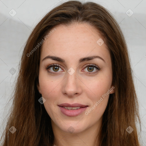 Joyful white young-adult female with long  brown hair and green eyes