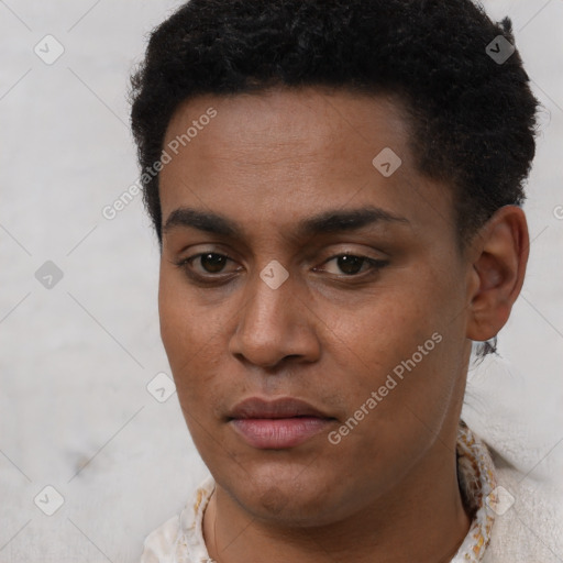 Joyful black young-adult male with short  brown hair and brown eyes