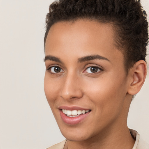 Joyful white young-adult female with short  brown hair and brown eyes