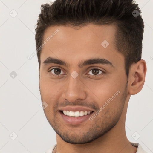 Joyful white young-adult male with short  brown hair and brown eyes