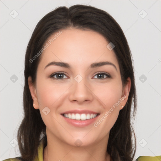 Joyful white young-adult female with long  brown hair and brown eyes