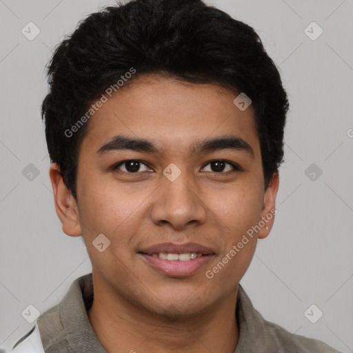 Joyful latino young-adult male with short  black hair and brown eyes