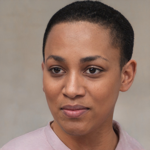 Joyful black young-adult female with short  black hair and brown eyes