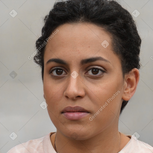 Joyful latino young-adult female with short  brown hair and brown eyes