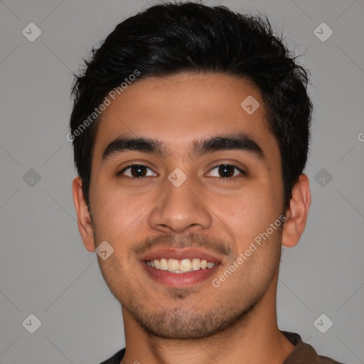 Joyful latino young-adult male with short  brown hair and brown eyes