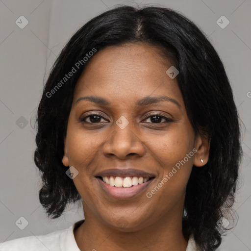 Joyful black young-adult female with medium  black hair and brown eyes