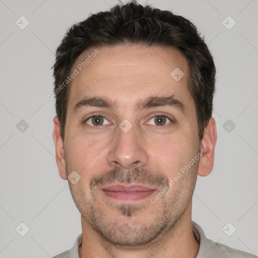 Joyful white adult male with short  brown hair and brown eyes