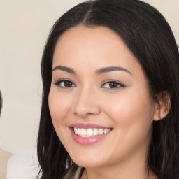 Joyful white young-adult female with long  black hair and brown eyes