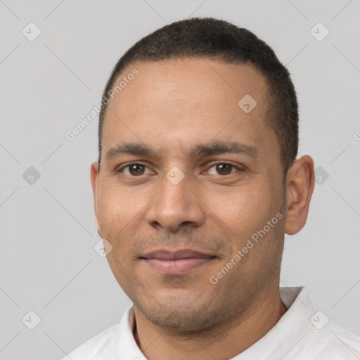 Joyful white young-adult male with short  black hair and brown eyes