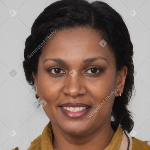 Joyful latino adult female with medium  brown hair and brown eyes