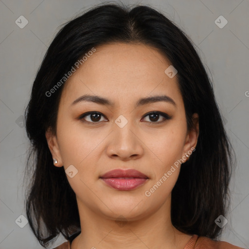 Joyful latino young-adult female with medium  brown hair and brown eyes