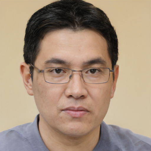Neutral asian adult male with short  brown hair and brown eyes