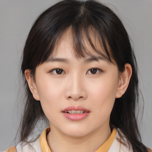 Neutral asian young-adult female with medium  brown hair and brown eyes
