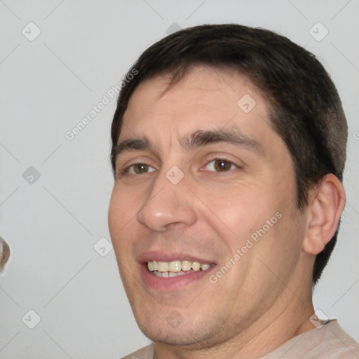 Joyful white adult male with short  brown hair and brown eyes